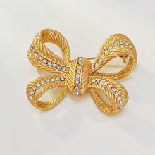 Load image into Gallery viewer, Stunning Gold Croissant Ribbon Bow Brooch Pin with Crystal Accent
