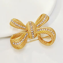 Load image into Gallery viewer, Stunning Gold Croissant Ribbon Bow Brooch Pin with Crystal Accent
